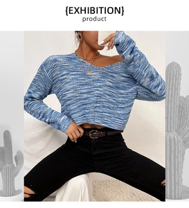 Close-up of chunky knit texture and blue-white mixed yarn on a V-neck cropped sweater
