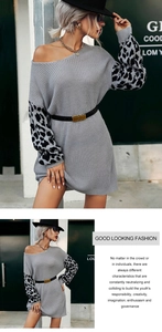 Detail of grey knit dress featuring leopard print sleeves and off-shoulder neckline