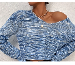 Detailed close-up of blue and white space-dye knit fabric and chic V-neck collar texture