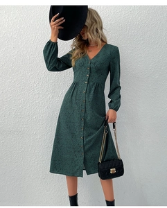 Detail of dark green leopard print dress with V-neck, button front and cinched waist