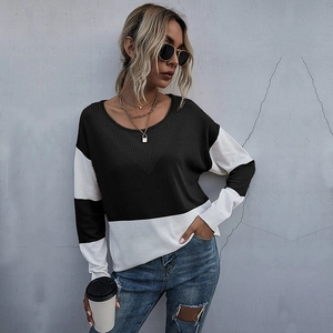 Women's casual color block knit sweater with crew neck and black and white patchwork design