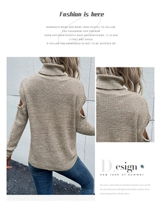 Detail showing high turtleneck and cold-shoulder cut-out design on khaki knit sweater