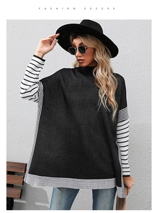 Detail shot of black high-neck knit sweater featuring stylish striped cuffs and hem