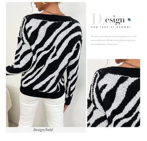 Detail of V-neck zebra print knit sweater showing soft fabric texture and relaxed fit