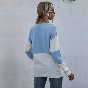 Loose color-block knit sweater in blue and white with a round neck and casual fit