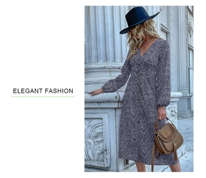 Close-up of elegant V-neck floral midi dress with button details and long sleeves