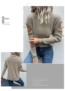 Detail of oat-colored knitted sweater featuring shoulder cut-outs and turtleneck design