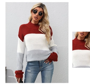 Close-up detail of the red white and grey color block chunky knit sweater collar