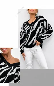 Detail of V-neck zebra print knit sweater showing black and white texture and fabric