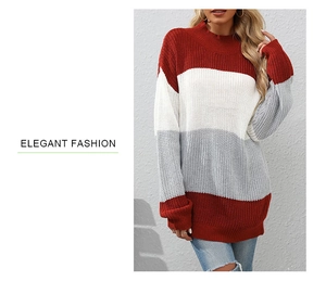 Close-up of color-block knit sweater with red, white and grey chunky striped texture