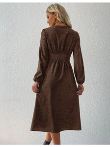 Detail view of leopard print dress back showing the elastic waist and high neck design