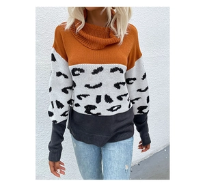 Detail of leopard print stitching and ribbed cuffs on a tri-color turtleneck sweater