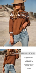 Detail of a brown knit sweater with retro geometric patterns on neck and shoulders