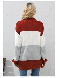 Back view of a loose knit striped sweater in brick red, white, and light grey colors
