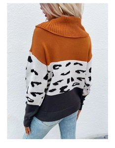 Macro detail of tricolor knit sweater with leopard pattern and high neck collar