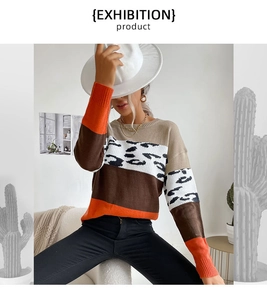 Detail of color block leopard print knit sweater with ribbed cuffs and crewneck
