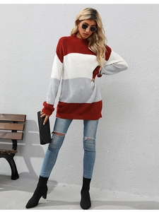 Detailed knit texture of red, white and grey color block striped sweater on model