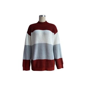 Detail of color-block knit sweater featuring burgundy, white, and grey textured panels