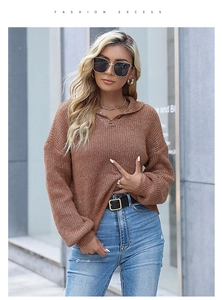Detail of a brown knit sweater featuring a lapel collar and single-breasted button design