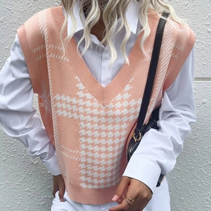 Women's V-neck houndstooth knit sweater vest in beige layered over a white shirt