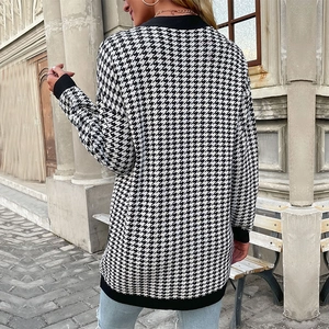 Back view of a long houndstooth knit cardigan sweater for women in black and white pattern