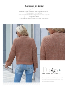 Close-up detail of terracotta ribbed knit sweater showing premium fabric texture and seams