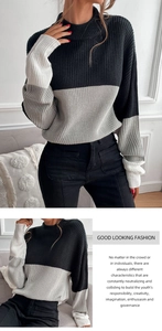 Close-up of high-neck color-block sweater with detailed vertical ribbed knit texture