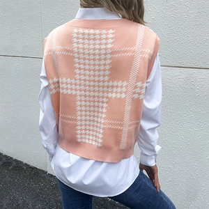Pink and white houndstooth knitted sweater vest for women shown from a back perspective
