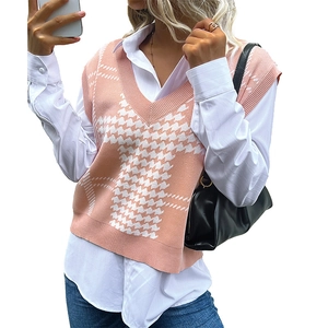 Pink and white houndstooth knit vest featuring a V-neck and a casual layered style