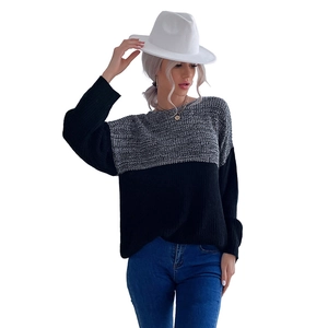 Women's oversized patchwork sweater with grey cable knit and black stitching