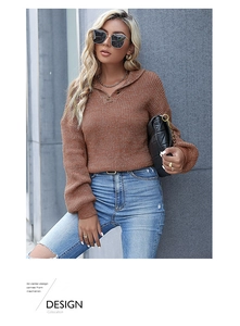 Detail of brown waffle knit sweater featuring a buttoned lapel collar and casual loose fit