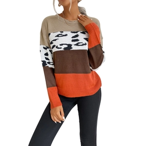 Women's crewneck knit sweater featuring casual color block design and leopard print details