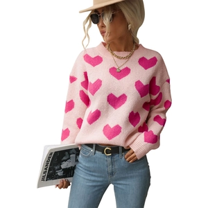 Pink crew neck knit sweater for women with deep pink heart patterns and ribbed trim