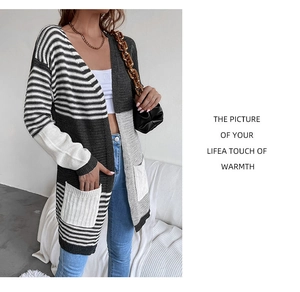 Detail of tricolor striped knitted cardigan featuring two large front white square pockets