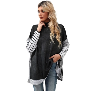 Women's dark grey knit sweater with striped batwing sleeves and a semi-high collar