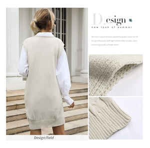 Macro details of cable knit texture and ribbed hem on a beige sleeveless sweater dress