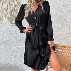 Chic black long sleeve pleated dress with V-neckline and elegant waist tie detail