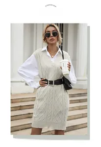 Detailed knit texture of a vintage ivory cable knit vest dress with a deep V-neck