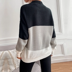 Back view of women's long sleeve color block knit sweater in black gray and white