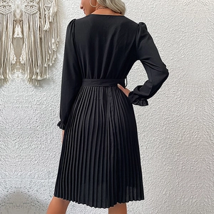 Elegant black long-sleeved pleated dress with waist belt and ruffled cuffs back view