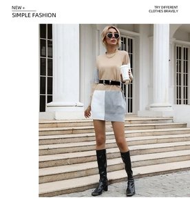Détail d'une robe en tricot color-block avec ceinture à la taille et manches longues