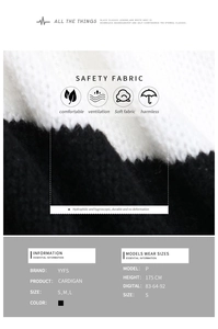 Detail view of monochrome color-block knit cardigan showing soft texture and fabric specs