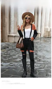 Detail of color block knit cardigan with orange white and black panels and large pockets