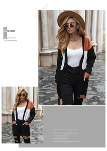Detail of color-block knit cardigan featuring large orange and black panels with pockets
