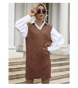 Close-up of caramel cable knit texture on a long V-neck sweater vest for women