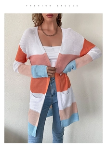 Detail shot of multicolor striped knit cardigan featuring soft texture and side pockets
