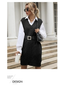 Detail of cable knit vest with white shirt and pearl buckle belt on street model