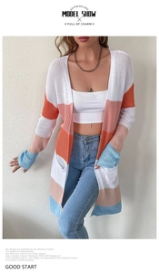 Close-up of multicolored striped knit cardigan showing vibrant fabric texture and design