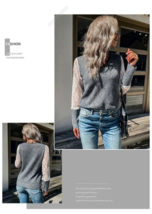 Close-up detail of grey diamond knit sweater with elegant white floral lace sleeves