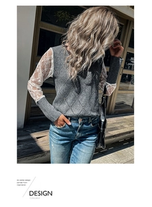 Detail of grey knit sweater showing white lace patchwork sleeves and diamond texture